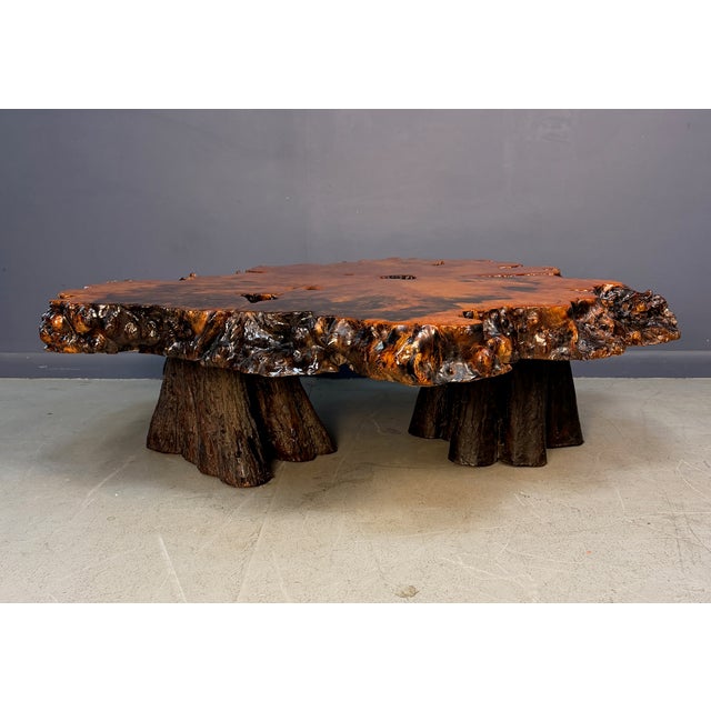 A dramatic 1970s California redwood burl coffee table, cut from a single slab with a naturally sculpted live edge. The top...