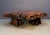 A dramatic 1970s California redwood burl coffee table, cut from a single slab with a naturally sculpted live edge. The top...