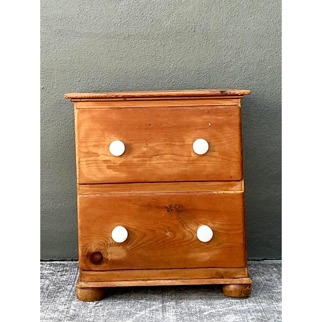 This charming vintage bedside chest epitomizes the rustic elegance of English Country design, offering an organic warmth...