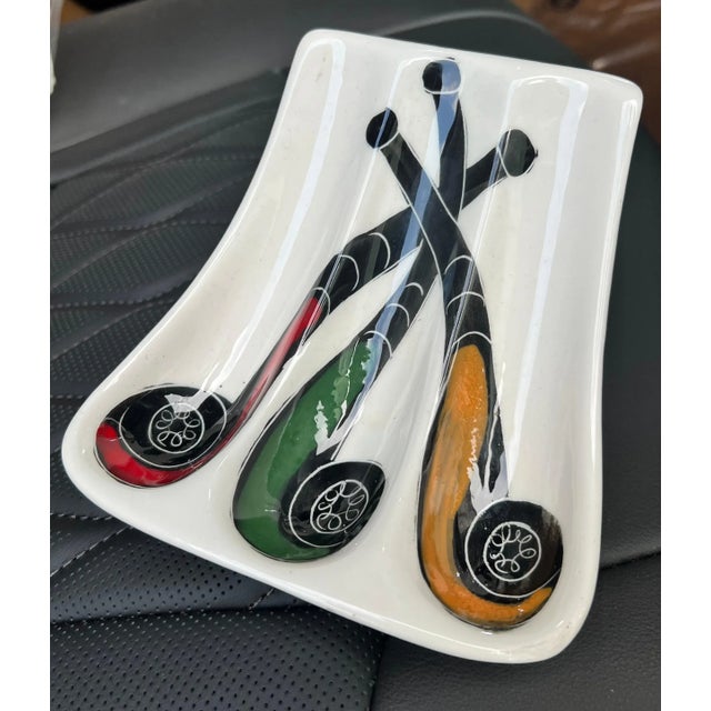 A wonderfully decorative piece - designed to hold pipes, but works well as a stand alone. Hand painted in Italy, it is...