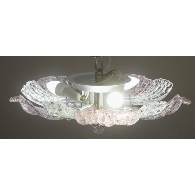 Elegant vintage Murano ceiling light with pink glass leaves from a historic Neapolitan pizzeria. Period: circa 1970. The...