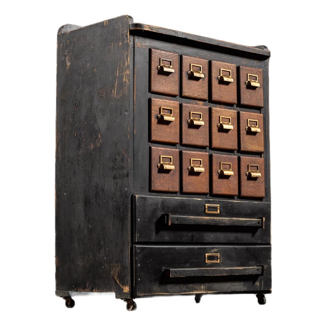 Early 20th Century Wooden 14 Drawer Rolling Shop Cabinet in Distressed Black For Sale