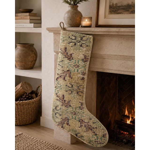 Hand-cut from a genuine vintage Turkish wool kilim, this stocking blends soft sage green, dusty rose, and teal accents...