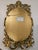 Mid-Century Modern Hollywood Regency oval mirror manufactured in the United States by Turner Mfg. Co., circa 1967. This...