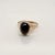A very fine antique gold and garnet signet style ring. Set with a large, dark oval garnet cabochon in 14k gold. Simply a...