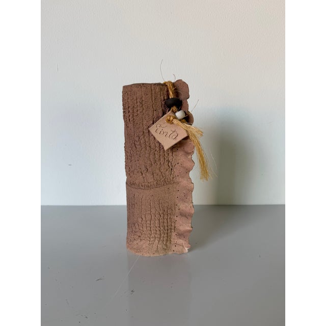 This vintage handmade studio pottery vase by Tinta showcases a beautifully organic sculptural form with a richly textured...