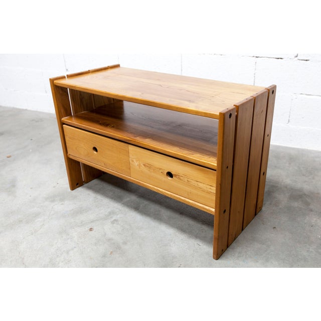 Low cabinet, TV stand, coffee table with drawers, or room divider, made by Maison Regain in solid elm in the 1960s. It is...