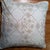 Natural delicate embroidery covers these elegant cream pillows. The cotton fabric is edged in a tiny welt with zipper...