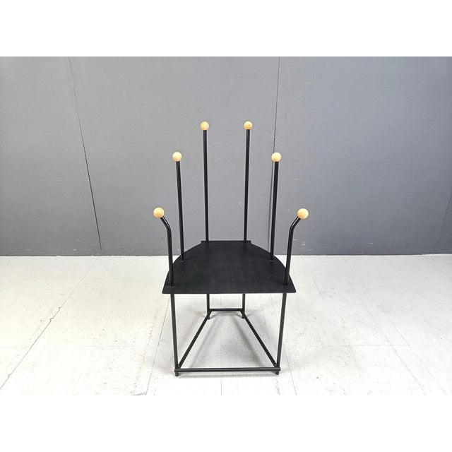 Post modern metal side chair. The chair has a timeless design, and has wooden ends on the metal rods. 1980s - Belgium...