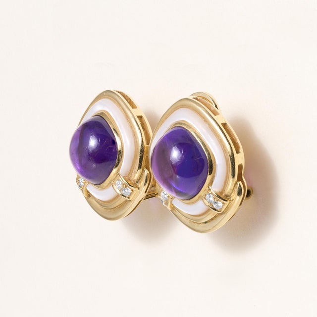 We offer free 2-day shipping! These are a pair of vintage clip-on earrings featuring cabochon amethysts, diamonds and...