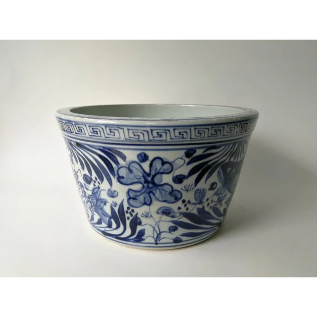 This small blue and white planter is hand-made and hand-painted with traditional blue and white motif by ceramist from...