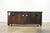 This Tommy Bahama entertainment console from the Wellington collection features a richly finished tamarind wood case with...