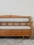This lovely piece is an early 20th century Swedish bench. Crafted from pine, it features charming rail and stile back...