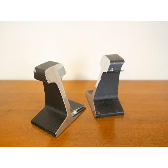 Killer pair of vintage railroad tie style bookends. One face of each seems to be nickel plated. The others are black....