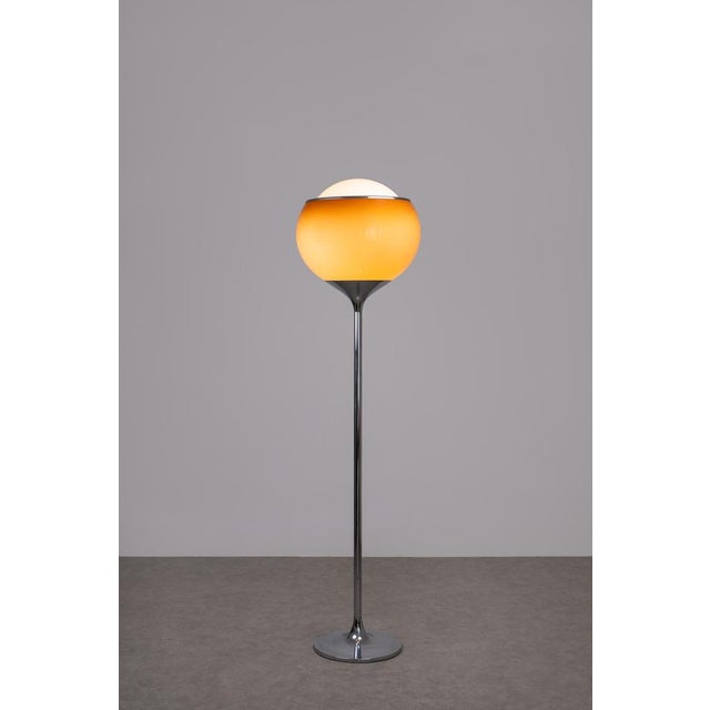 An iconic floor lamp, model "big bud", designed by harvey guzzini & studio 6g and produced by guzzini in italy around...
