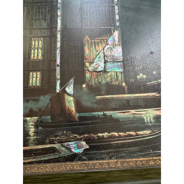 This elegant clock is painted on wood featuring intricate mother-of-pearl inlay detailing and is housed in an Edwardian...