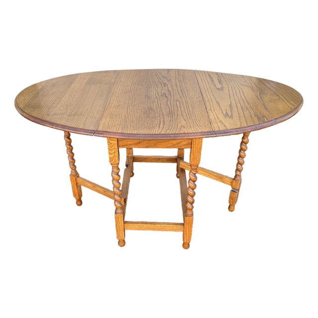 Early 1900's English Oak Barley Twist Oval Gate Leg Table For Sale