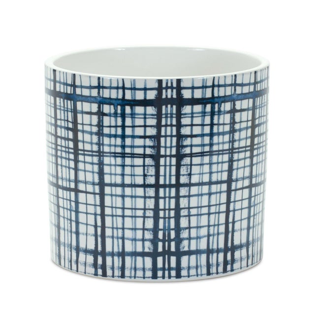 Add a touch of classic charm to your space with this Set of Criss Cross Pattern Planters. Featuring bold blue and white...