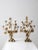 A pair of late 19th-century antique brass candelabras, each featuring seven candleholders arranged among an elaborate...