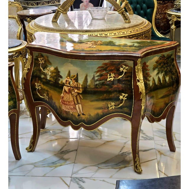 Bring timeless French elegance into your home with this breathtaking Hand-Painted Rococo Bombe Commode, a true statement...