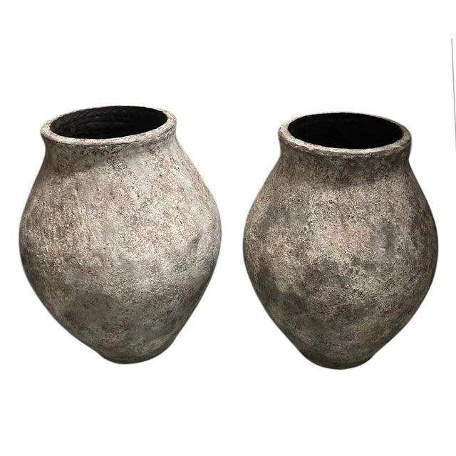 This striking pair of large-scale terracotta planters brings an immediate sense of history and Mediterranean grandeur to...