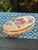 A charming vintage Limoges porcelain trinket box handcrafted in France. This petite oval box features delicate hand-...