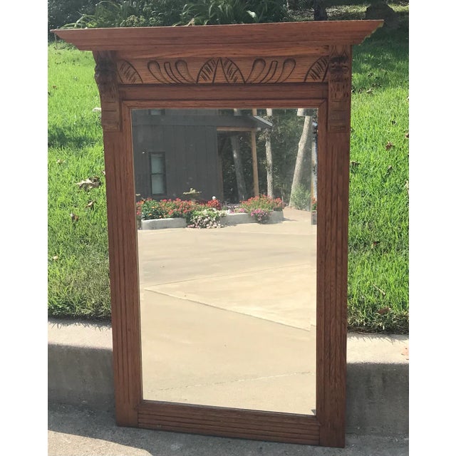 Lovely very heavy solid wood framed beveled mirror with carved details. Direct from a Belgium.