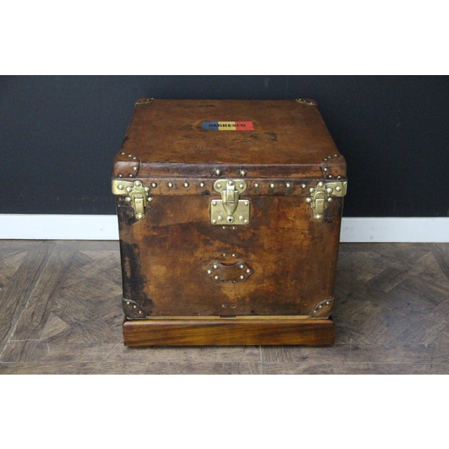 This Louis Vuitton trunk is quite unique due to its cube shape and the fact that it is made entirely of leather. The...