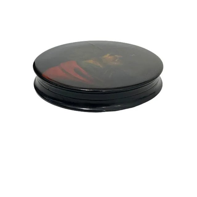 Papier-Mâché snuffbox, A snuff box painted with a portrait of a bearded man with a turban, possibly after a painting by...