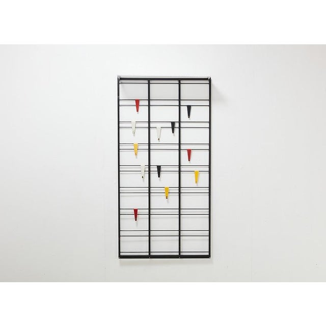 Cool coat rack, model Servo Muto or 'Toonladder', designed by Tjerk Reijenga in the 1950s for Pilastro. Minimalist design...