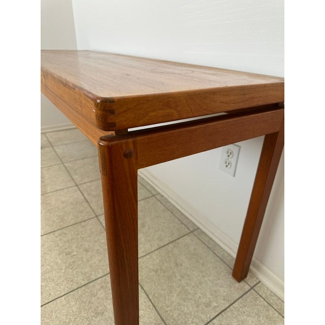 d-SCAN solid teak long console table with rounded corners.