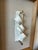 Vintage sculptural relief mounted within a newly constructed custom frame. The original piece features an abstract, folded...