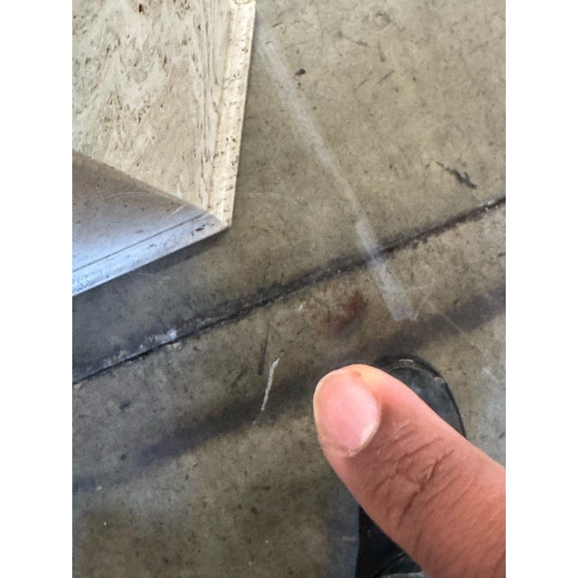 W48 D48 H29 KC28 Dining table with rarely seen solid travertine cross bars. Table is structurally sound with no visible...