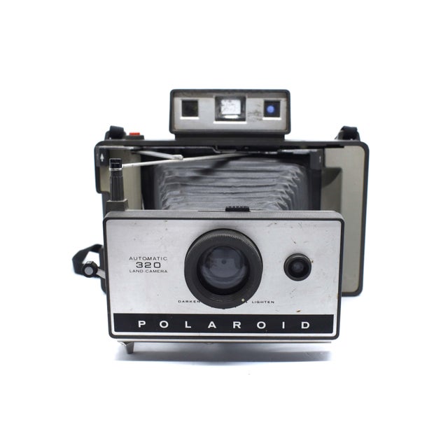 Capture a piece of photographic history with this vintage Polaroid Automatic 320 Land Camera. Produced between 1969 and...