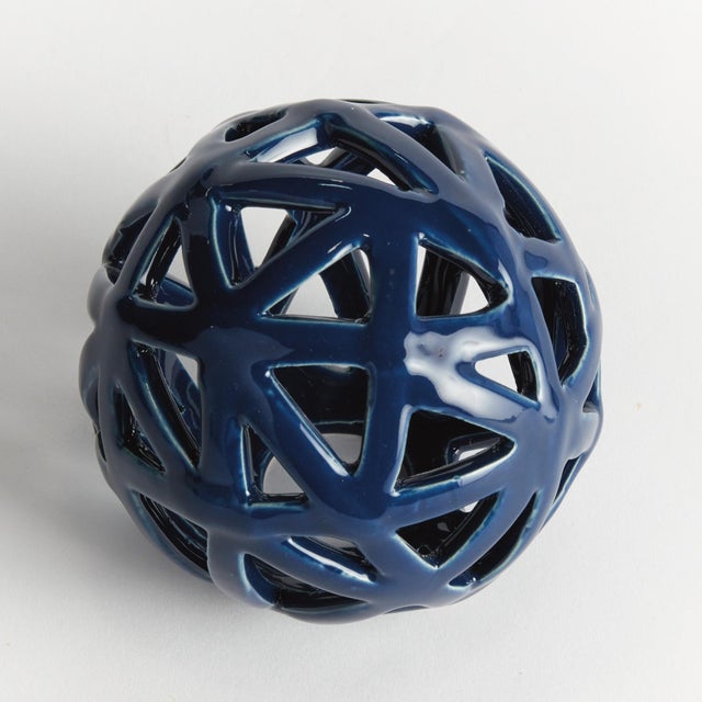 This contemporary little orb is made of thin ceramic strips, which are hand formed, and sparingly shaped into a rounded...