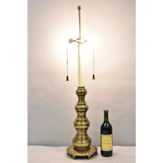 Vintage Stiffel Hollywood Regency Tall Brass Candlestick Column Table Lamp. Circa Late 20th Century. Measurements: 37" H...