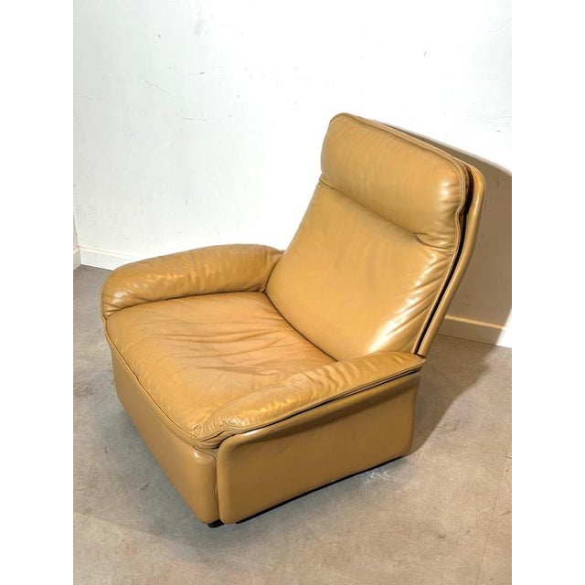 Iconic vintage lounge chair model DS- 50 by de Sede, produced in Switzerland and upholstered in high-quality camel brown...