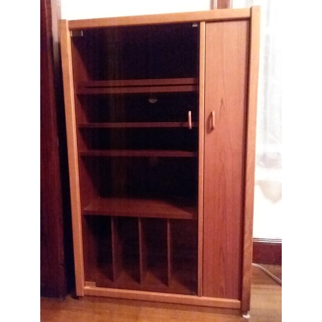 Selling a very rare, beautiful, solid teak media cabinet in excellent condition. Purchased from Scandinavian Designs....