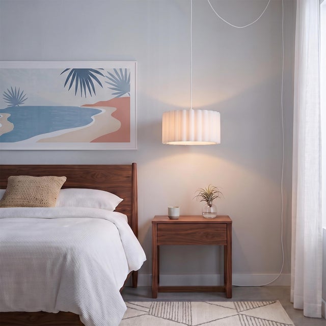Constructed with a Satin Nickel Steel body and a Drum White Linen shade, the Scallop Kit is a versatile lighting solution...