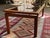 Beautiful vintage MCM Danish modern coffee table made in Denmark by Kristiansen Thomassen from solid teak with two smoked-...