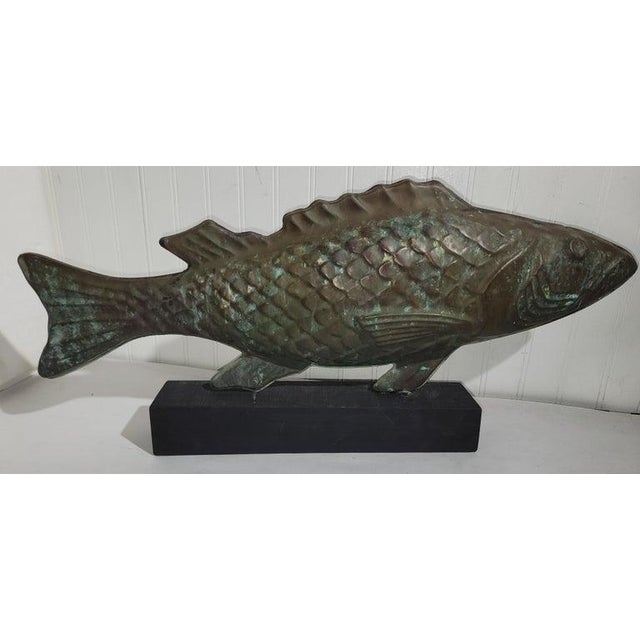 This full body copper fish weather vane is mounted on a wood block and is in fine condition with a wonderful aged patina....