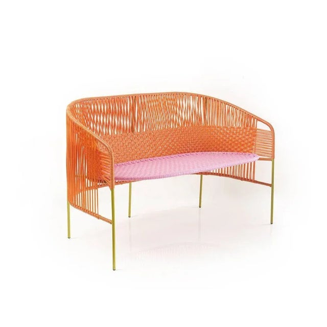 Orange caribe 2 seater bank by sebastian herkner materials: galvanized and powder-coated tubular steel. Pvc strings are...