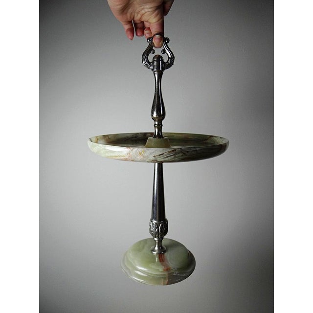 Magnificent display stand in onyx veined with rust and beige, a fine stone that is translucent in the light, and silvered...