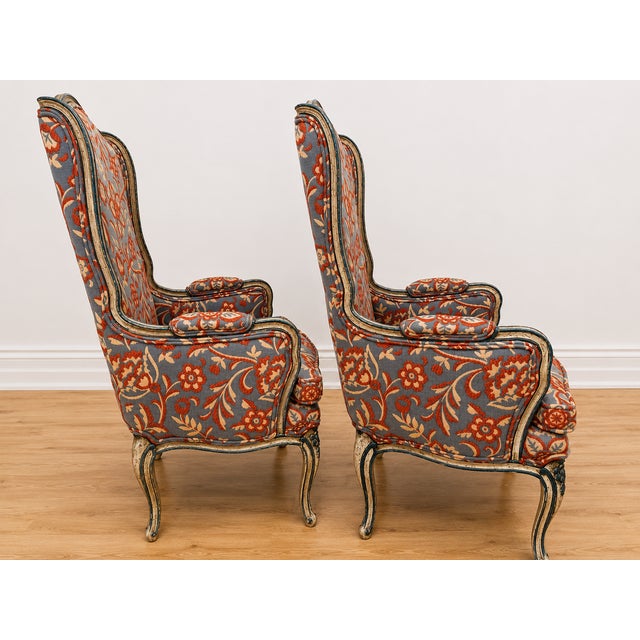 Stunning, matched pair of vintage French Provincial wingback accent chairs by the historic Cochran Chair Co. Prestige...