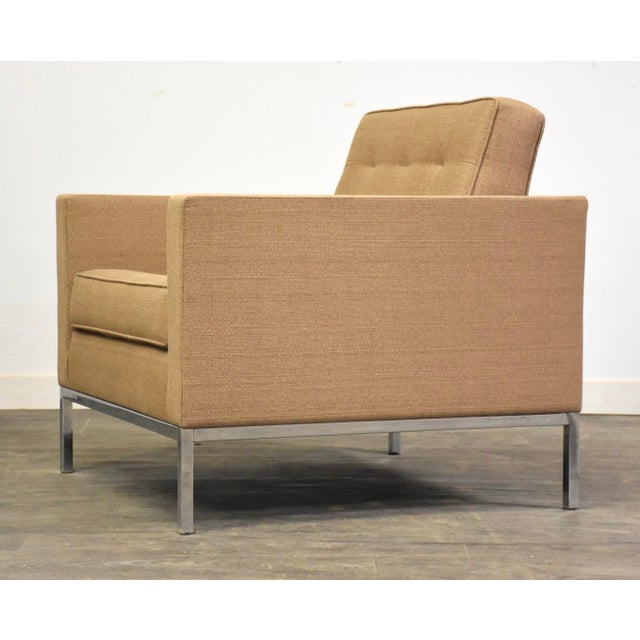 A mid century modern heavy gauge steel base lounge chair with a chrome finish designed by Florence Knoll. Seat height is...
