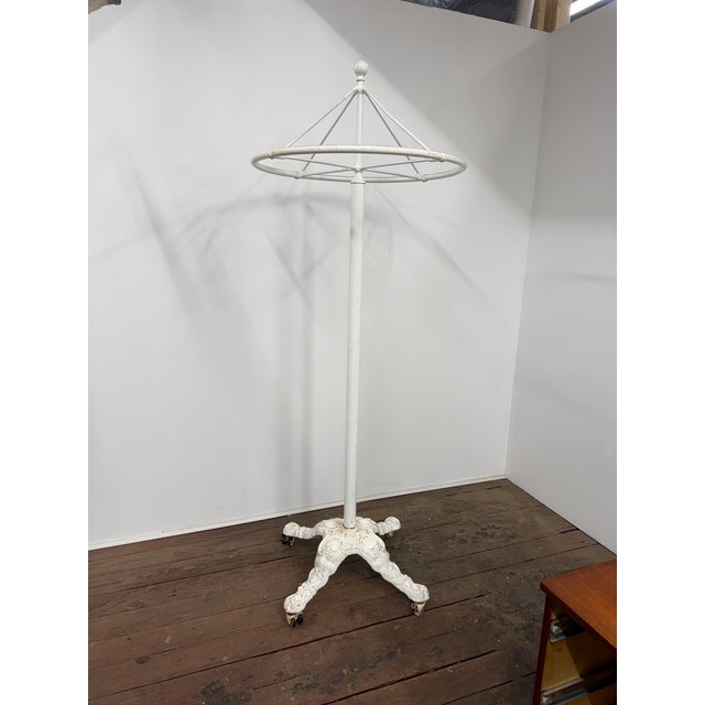 Norwich Nickel and Brass Company standing revolving clothing rail. The revolving top portion makes for easier display and...