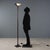Reflected light floor lamp with black and red enamelled and lacquered aluminium structure and prismatic glass diffuser....