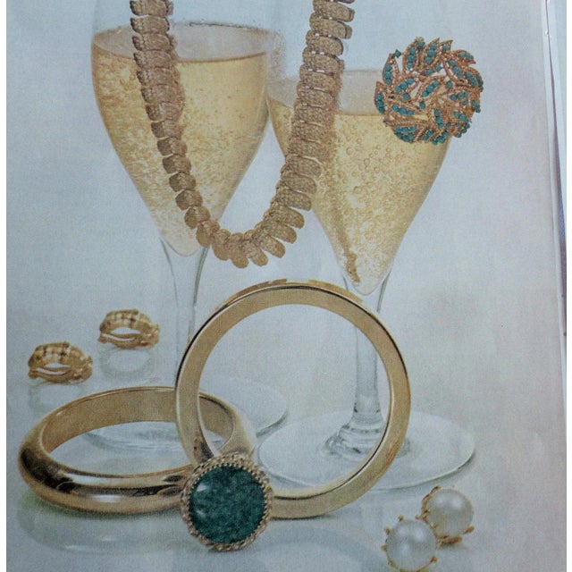 This is part of Chairish’s Costume Jewelry assortment. Goldtone textured scale like s shaped links bracelet with fold over...