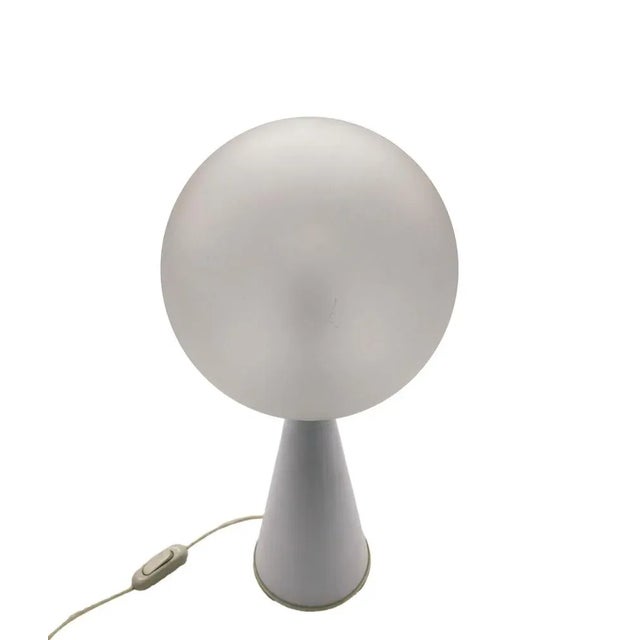 This extremely rare and iconic lacquered metal and frosted glass table lamp, mod Bilia, was made in 1960s Italy, designed...