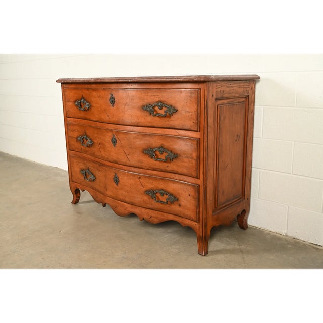 A gorgeous French Provincial Louis XV style commode or dresser chest By Ralph Lauren Circa Late 20th Century Solid carved...